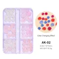Macro detail of UV light-sensitive color-changing resin flower nail charms in storage box - Mixed Light Sensitive Color Changing Camellia 02 / 6 Grids Box