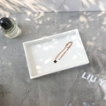 Elegant gold necklace with a black four-leaf clover pendant on a luxury marble background - Small White PU Leather Empty Tray - No Lid