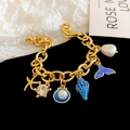 Gouden bedelarmband met zeesterren, emaille schelpen en barokparels voor dames - Blauwe Zeester Wulk Armband