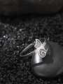 Macro shot of silver butterfly ring with spiral motif on dark stone base - NR309 Butterfly Spiral