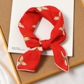 Red cotton linen square scarf with yellow floral pattern knotted on a decorative tray - Orchid Red Base