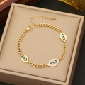 Goldenes Gliederkettenarmband mit blauen Augen-Anhängern und Strass in Schmuckbox - Armband / Gold