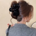 Elegant large black velvet bow hair claw clip for thick hair styling on a female model - Black Hair Claw