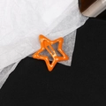 Vibrant orange star-shaped hair clip with glossy metallic finish in Y2K aesthetic style - Orange