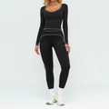Ensemble de yoga noir avec surpiqûres blanches, haut à manches longues et legging - S / Haut Et Bas / Noir Premium
