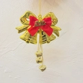 Elegant golden double Christmas bell ornament featuring a red bow and Feliz Navidad - Double Bell With Spanish Lettering / Gold