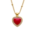 Close-up of a gold necklace with a red heart pendant and sparkling zirconia stones - Red Heart with Diamonds
