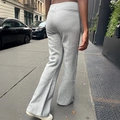 Women's flared yoga pants in solid grey color showing back view in urban setting - S / Mixed Grey