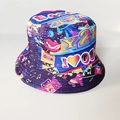 Close-up of retro Y2K graffiti print bucket hat with colorful Boom patterns - Y2K
