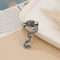 Detailed close-up of a vintage silver dragon brooch with intricate scales and antique finish - Antique Silver Dragon Style 1