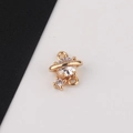 Macro detail of gold-plated planet charm with sparkling zircons and double hanging loops - 4# White