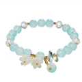 Elegant beaded bracelet with blue gems, golden beads, and white lily of the valley charm - S033 - Glass Imitation Magnolia Lily Of The Valley Bracelet - Blue And White #sz248
