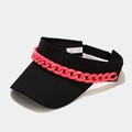 Detail of black sun visor featuring a chunky pink acrylic chain and polyester fabric - Adjustable / Black