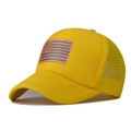Detail of breathable yellow trucker hat with American flag patch and mesh back design - Yellow