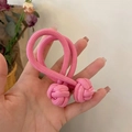 Close-up of pink high-elasticity hair tie with a decorative Chinese knot design - Pink