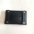 Close-up of black litchi pattern leather mini pouch with four brass snap buttons - Black