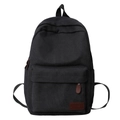 Front view of minimalist black canvas backpack with leather logo tag for daily use - Black