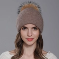 Women's angora knit beanie in taupe brown featuring a large fluffy faux fur pompom - Camel + Natural Pom-pom