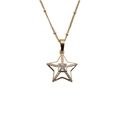 Detailed close-up of a gold star pendant necklace featuring sparkly cubic zirconia stones - White