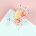 Creative resin popsicle keychain with peach slice and yellow stripe tube design - White Chocolate