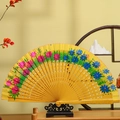 Hand-painted yellow wooden folding fan with colorful floral patterns and carved ribs - Yellow Style B
