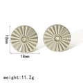 Detailed macro view of silver 18mm round steel earrings with radial texture and center dot - Silver with White Zirconia