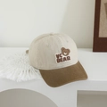 Detail view of a vintage kids' baseball cap featuring VC BEAR embroidery on a beige crown - VC Bear / Rice White & Brown