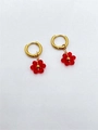 Gold hoop earrings with handmade red beaded flower charms and steel finish - Red