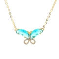 Elegante goldene Schmetterlingskette mit blauen Kristallen und weißem Zirkon-Mikropavé - Grün