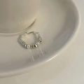 Silver beaded wavy ring with a white pearl accent on a minimalist ceramic plate - Artificial Pearl Wave Beaded Style (J3800)