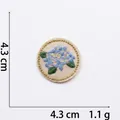 Macro view of blue floral embroidery patch with gold metallic edge 4.3cm diameter - 5# Light Blue Flower (Round)