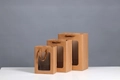 Three brown kraft paper gift bags with transparent windows and matching handles in varied sizes - Mini 15*10*20cm / Kraft Color