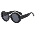 Lunettes de soleil rondes oversize noires avec monture texturée géométrique 3D ondulée - Monture noir sable verres gris