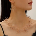 Elegant rose gold hollow flower necklace and earrings set worn by a fashion model - Hollow Floral Necklace Earring Set / Gold Set (KC Gold 2pcs)