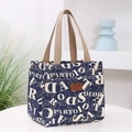 Donkerblauwe Oxford lunchtas met witte letters en een bruine lederen patch - Blauwe Letters