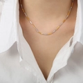 Minimalist gold and silver two-tone geometric bamboo link necklace on a model - Fine Style / Gold and Steel Mixed