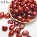 Polished natural Red Agate stones in a wooden bowl for home decor and aromatherapy - 100g/Pack / Red Agate