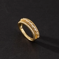 Detailed macro view of triple-row gold ring with baguette-cut and round-cut zircons - Three Row Baguette Zirconia Luxury Style