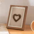 Minimalist dark wood frame with a rustic twig heart insert on a beige background - Hollow Coffee Color 5 Inch