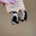 Macro shot of leopard print acrylic hoop earrings with a vintage resin texture design - C-Shape Leopard Print (Silver Pin-Coffee-Black)