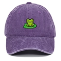 Close-up of vintage purple washed cotton baseball cap with detailed green frog embroidery - Purple