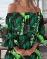 Detail van de off-shoulder halslijn en groene tropische print op een zwarte jurk - S / Groen Bloemen