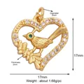 Golden heart bird pendant with white crystals and a green gem eye charm - Bird in Heart-Gold