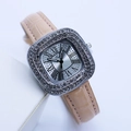 Detailed close-up of square silver rhinestone watch with beige leather strap and Roman dial - Pink Silver Case