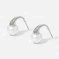 Detailed view of silver stainless steel earrings with white round pearls on white background - Silver (D2552)