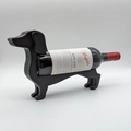 Macro shot of the black dachshund wine bottle holder highlighting its sleek textured finish - Small / Black