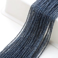 Macro view of 2mm faceted navy blue glass beads for DIY necklaces and jewelry making - Dark Blue Plated