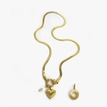 Golden heart pendant necklace with freshwater pearl and textured charms on snake chain - Gold - Letter O
