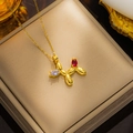 Golden balloon dog necklace featuring red and purple gemstones on a polished titanium chain - 8949 Golden Colorful Balloon Dog