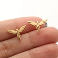 Golden angel wing stud earrings with a DNA helix center held by hand for scale - Gold Wing DNA (663)